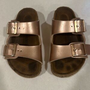 Well worn kids Birkenstock size 8 (26). Rose gold color.